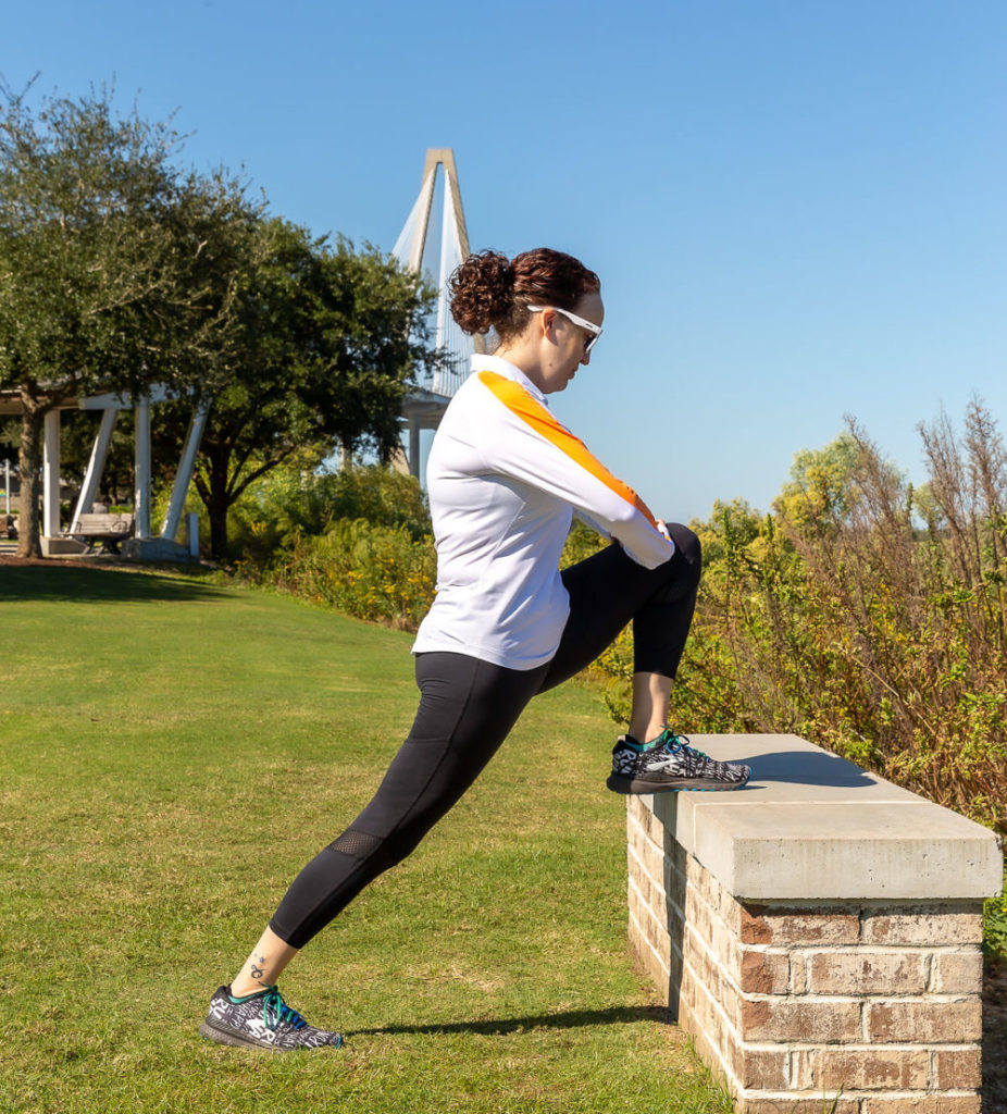 Woman stretching on a bench