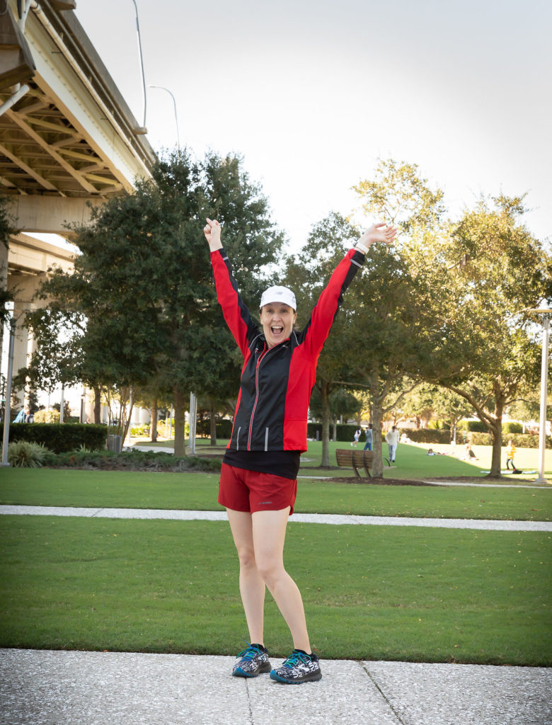 Woman raising arms in celebration