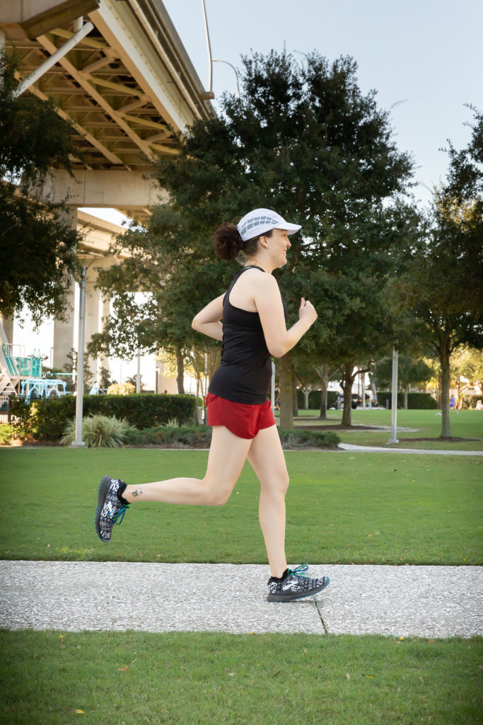 woman running through park